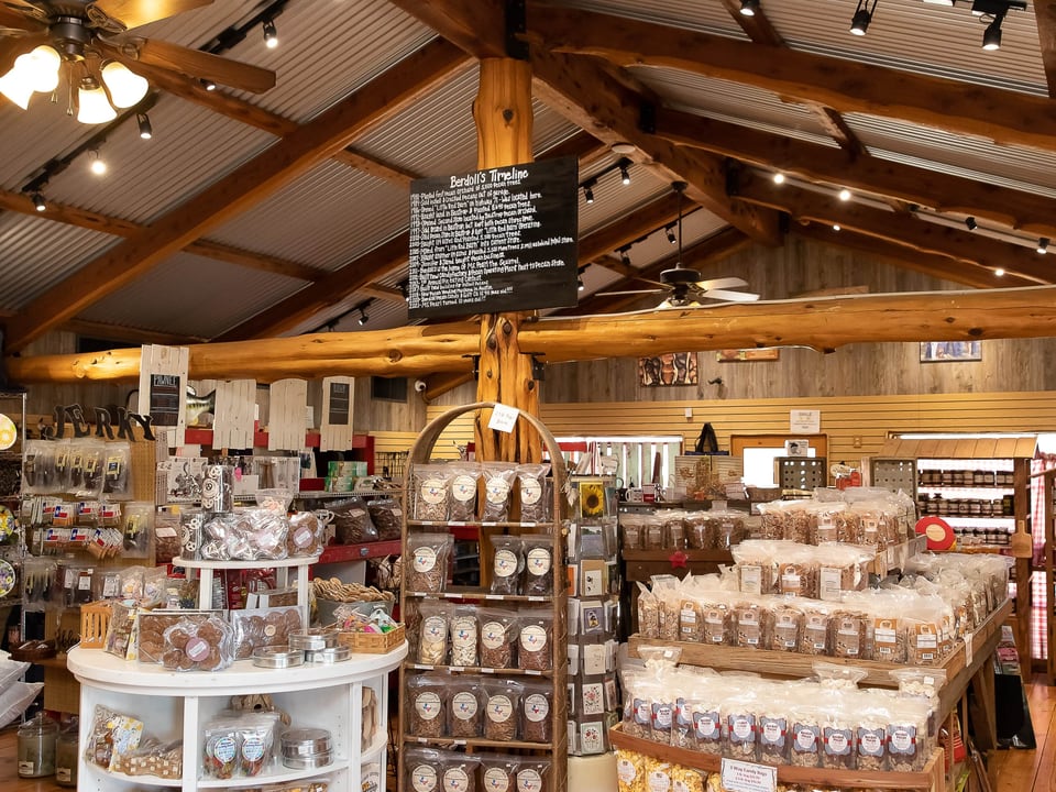 Wood-lined Berdoll Pecan Candy and Gift Company interior filled with pecan products and gifts