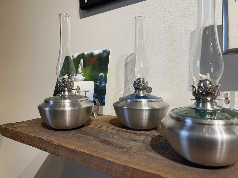 Handcrafted pewter oil lamps displayed inside Danforth’s Middlebury flagship store
