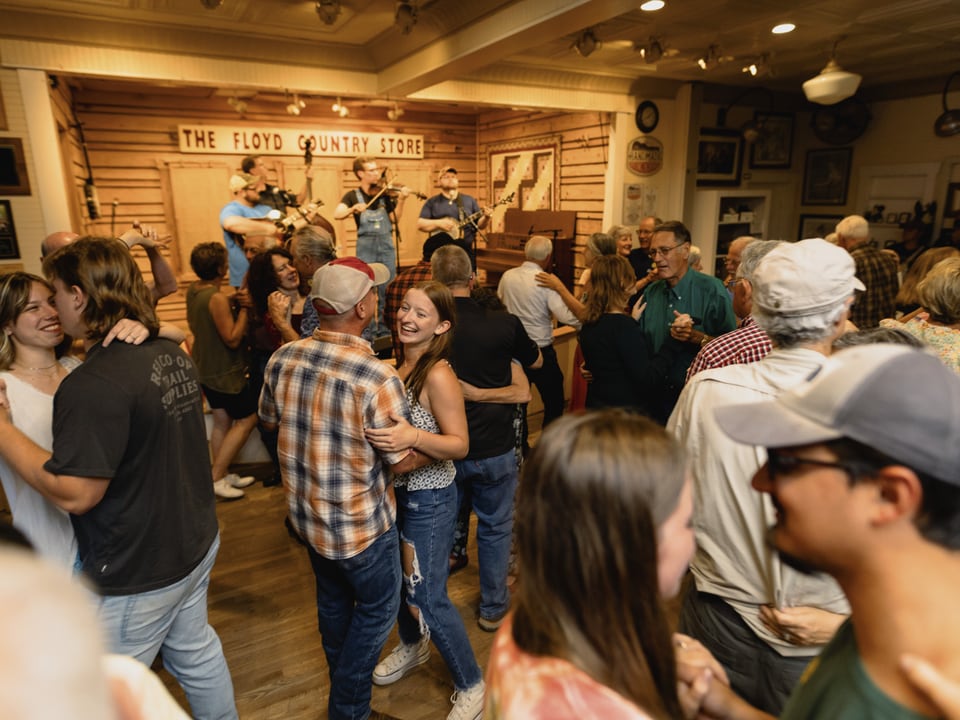 Dancers and musicians at the Friday Night Jamboree inside Floyd Country Store