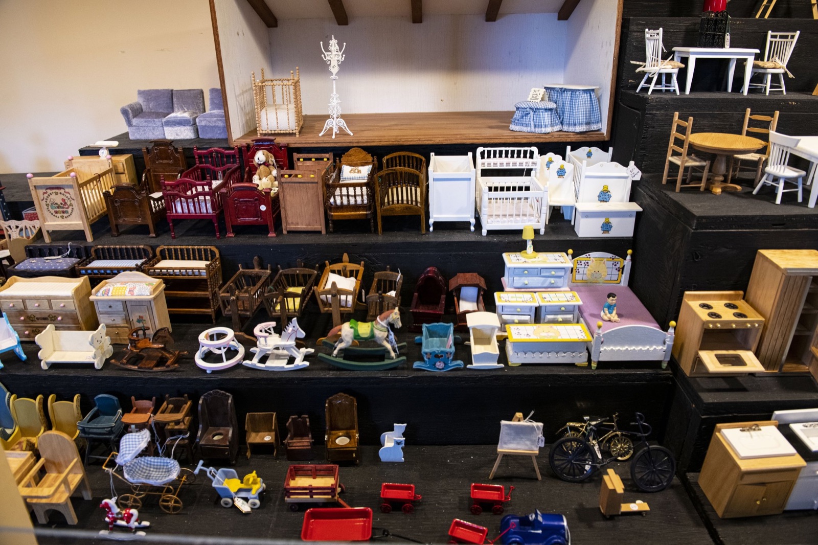 Shelves of dollhouse furniture for sale in the Great American Dollhouse Museum Miniatures Store