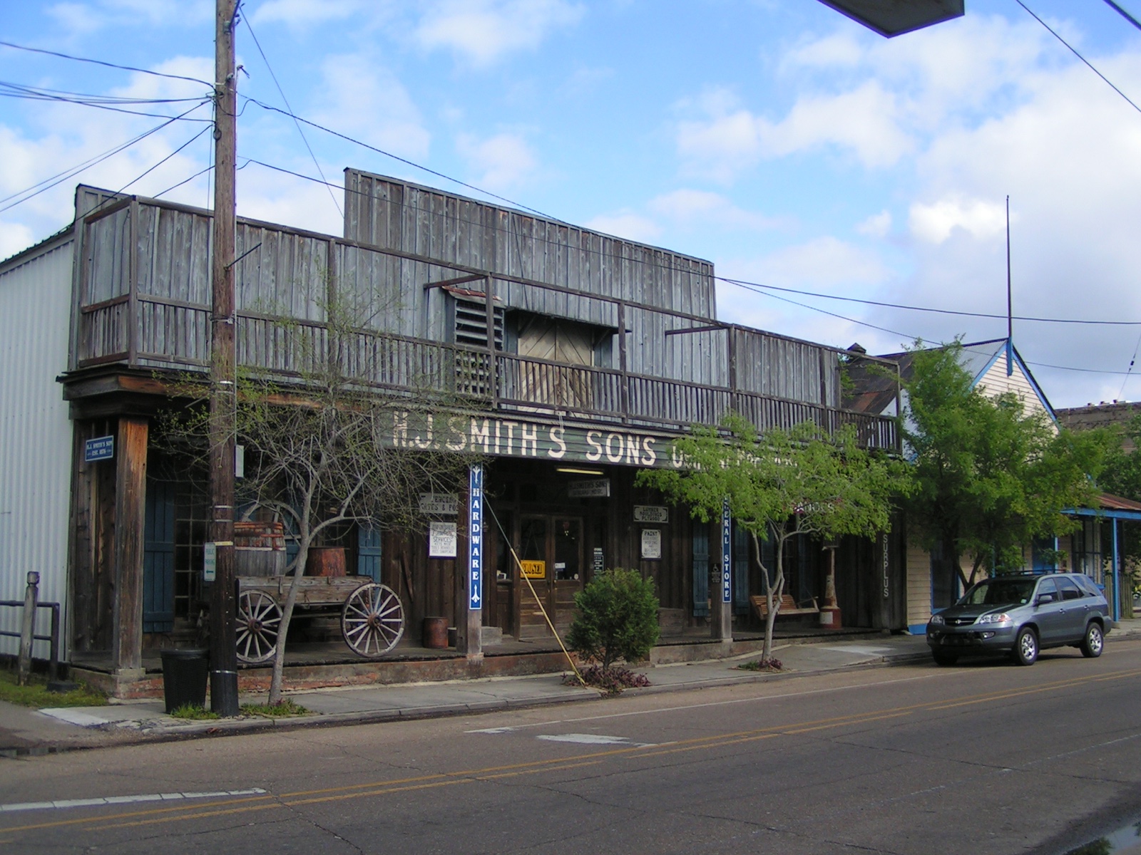 Weathered wooden H.J. Smith's Sons General Store and Museum storefront on Columbia Street in Covington