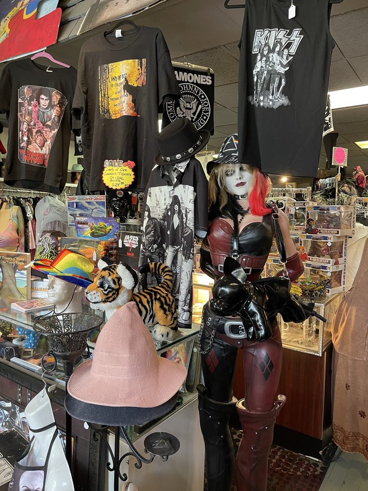 Interior of the Manitou Springs Land of Ozz with goth clothing, band shirts, mannequins, and memorabilia