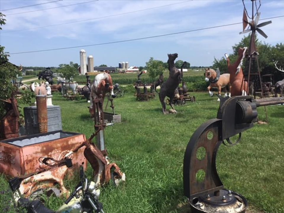 Oversized animal sculptures and metal oddities spread across the original M Schettl Sales grounds in Oshkosh