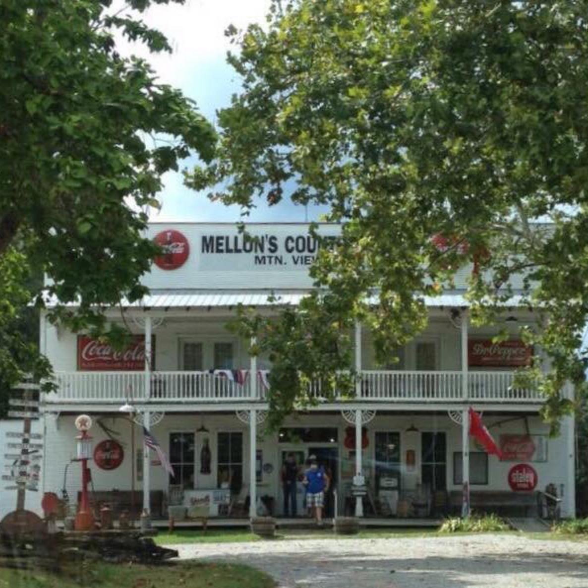 Exterior of Mellon's Country Store in Mountain View, Arkansas, framed by trees