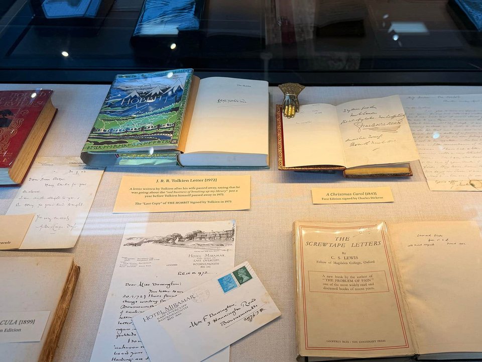 Rare books, letters and literary artifacts displayed in a glass case at Moon’s Rare Books