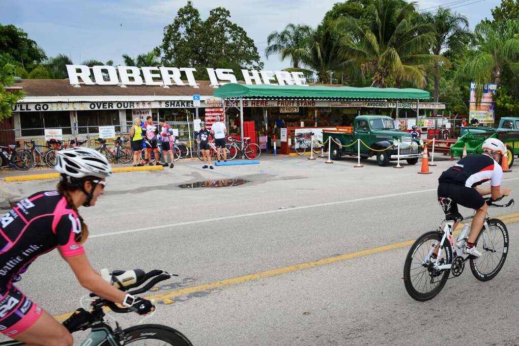 Roadside exterior of Robert Is Here in Homestead with its huge rooftop sign and fruit-stand entrance