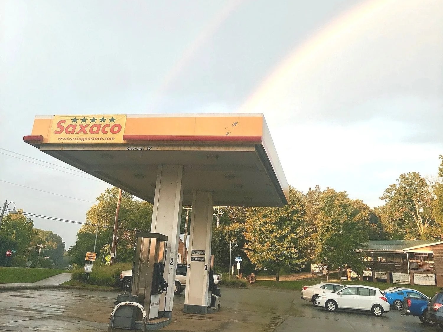 Saxaco canopy and fuel pumps in front of Saxapahaw General Store on a rainy day
