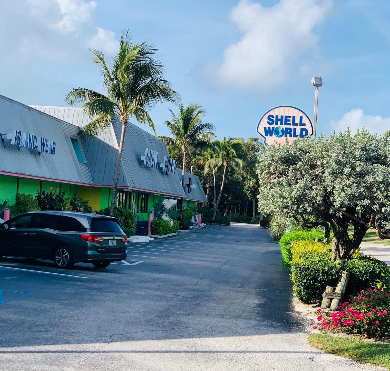 Exterior of Shell World in Key Largo with its large roadside sign and long Overseas Highway storefront