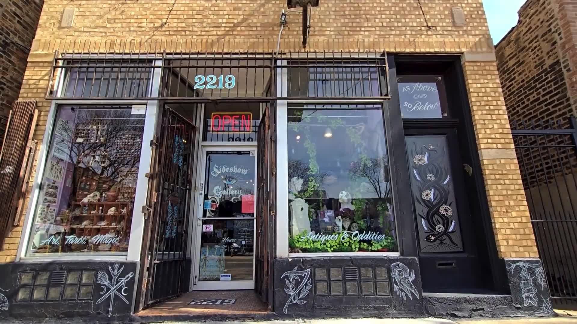 Sideshow Gallery exterior at 2219 N. Western Avenue with Art Tarot Magic and Antiques and Oddities window lettering