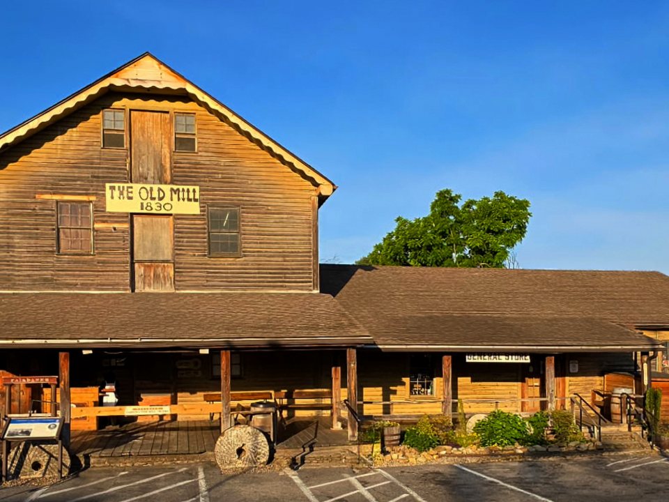 The Old Mill’s weathered 1830 gristmill and General Store facade in Pigeon Forge