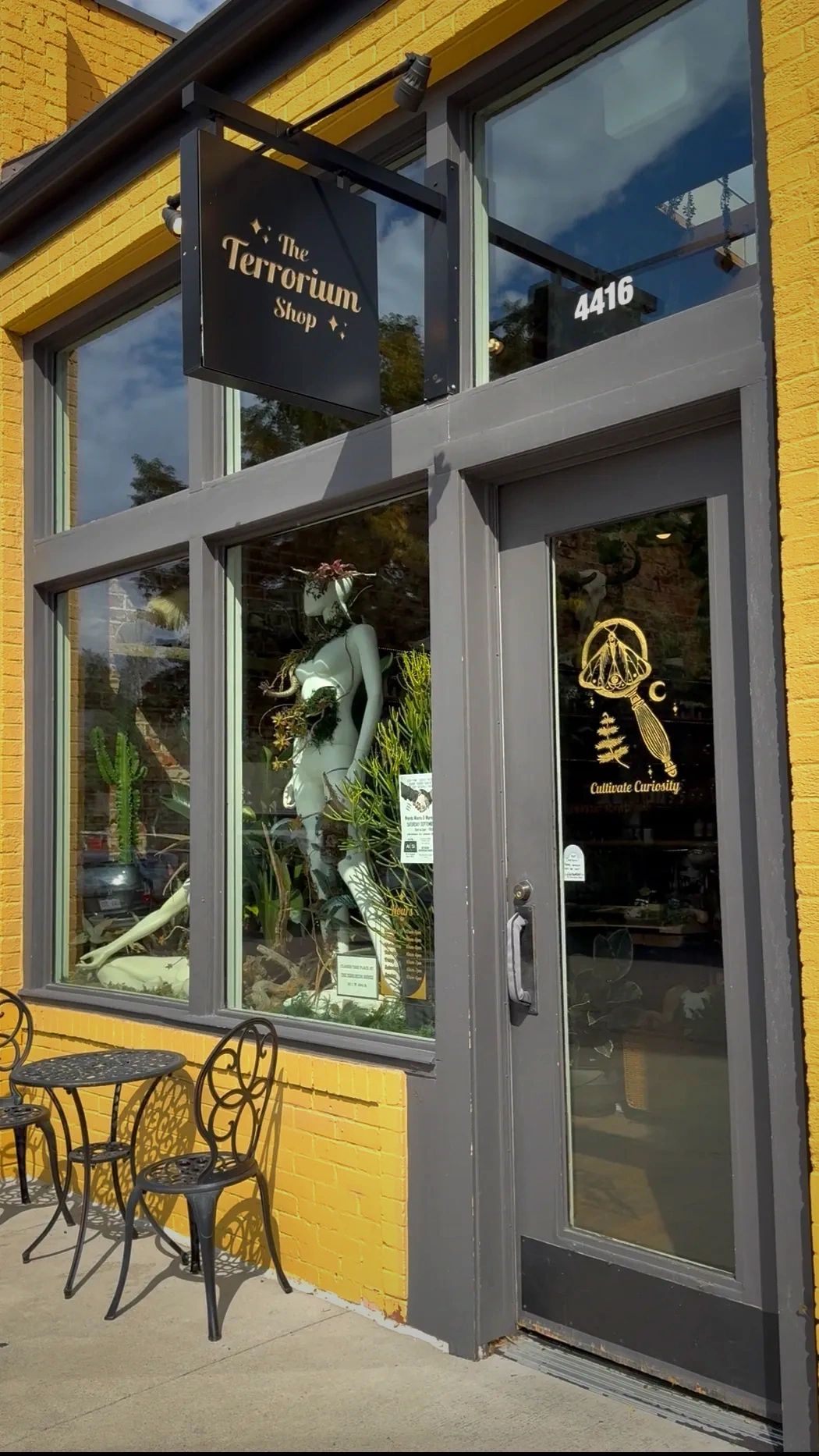 Exterior of The Terrorium Shop at 4416 Yates Street with its storefront sign visible